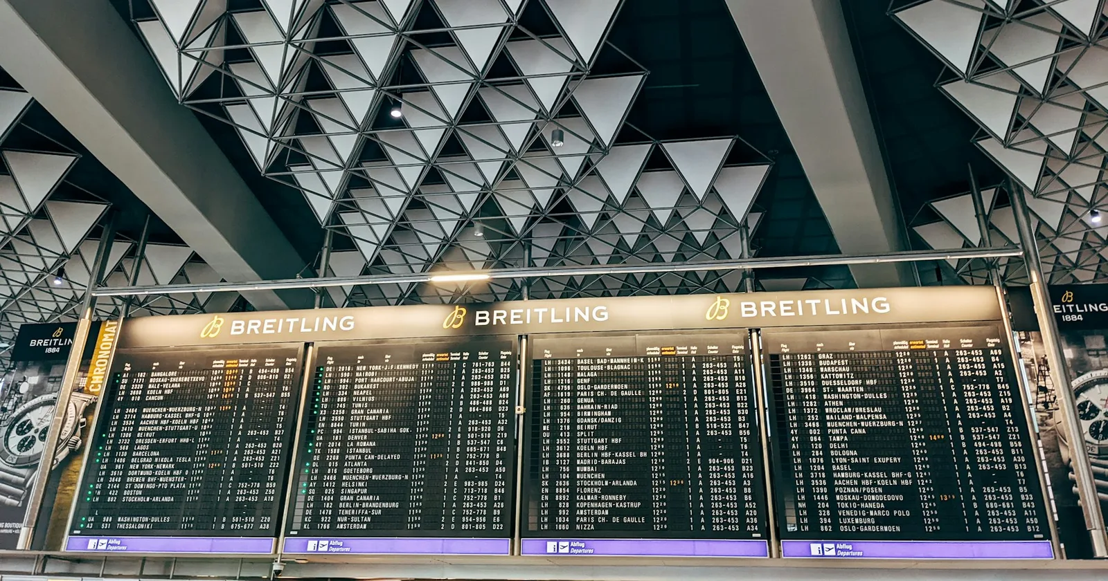 Airport board showing flight departures
